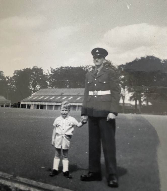 A 15 year old ChrisJ rightJ in military uniform with little brother Iain