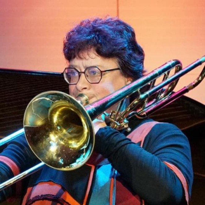 A young Emma on trombone back in England