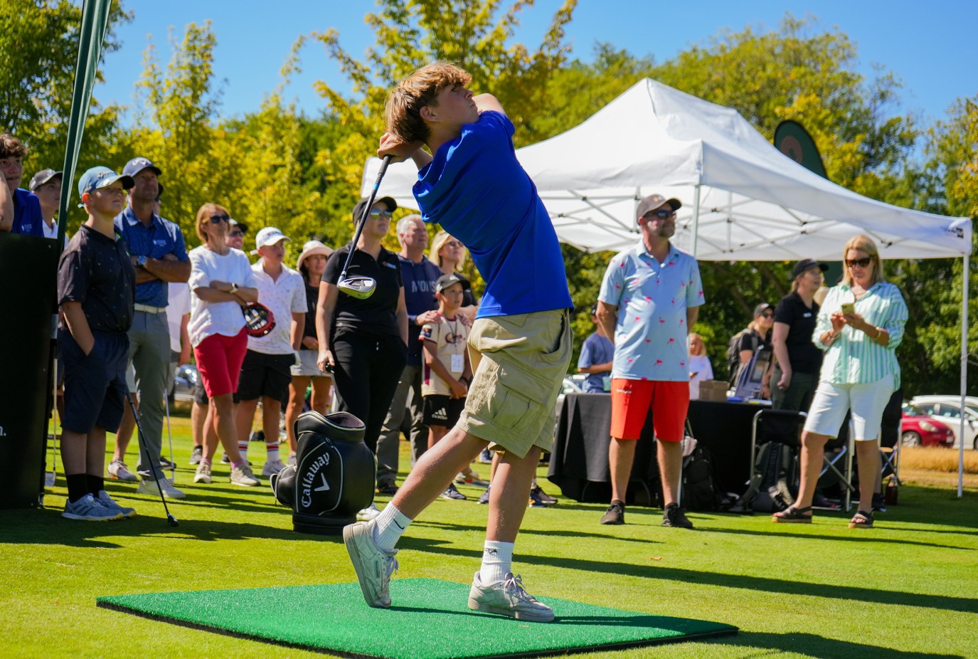 A young competitor tees off at Closest to the Pin copy