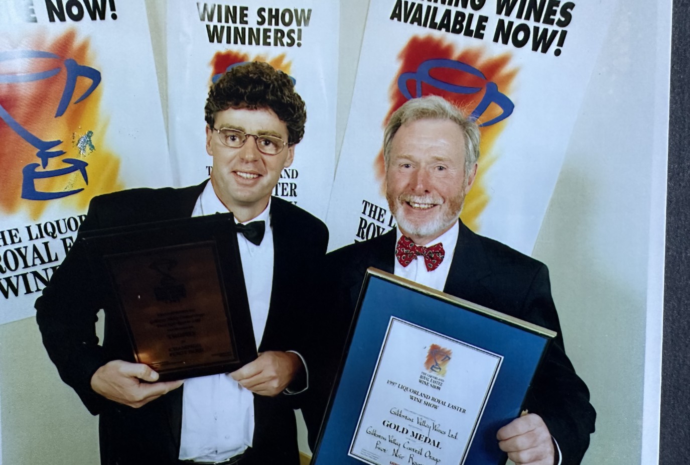 An elated Grant and Gibbston Valley Wines owner Alan Brady celebrate gold for Gibbston Valley Pinot Noir in 1995