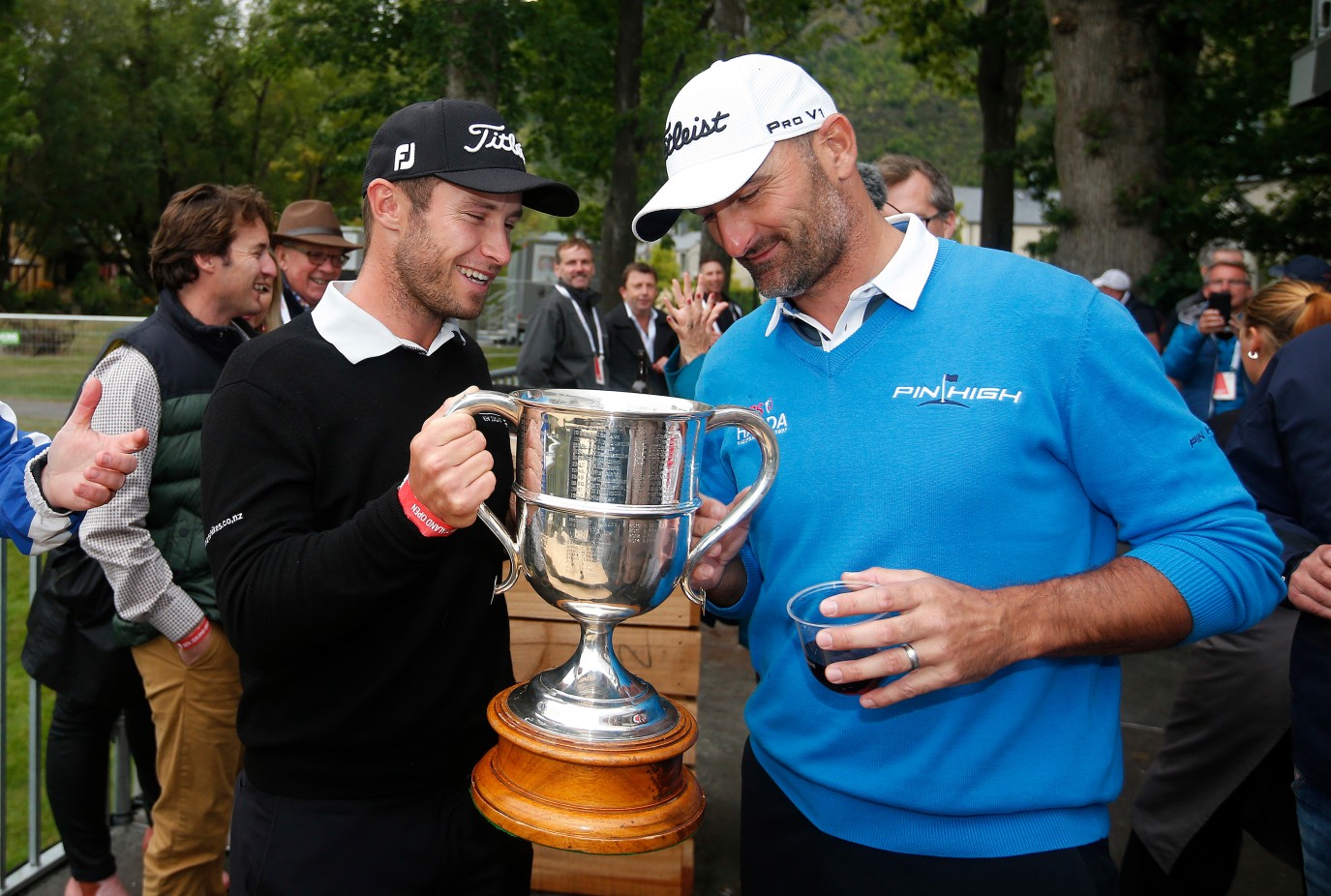 Ben Campbell and Michael Hendry inspect the New Zealand Open trophy Photosport