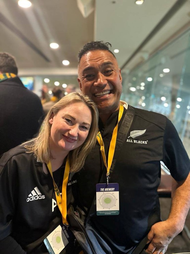 Big rugby fans Junior right and wife Kerri