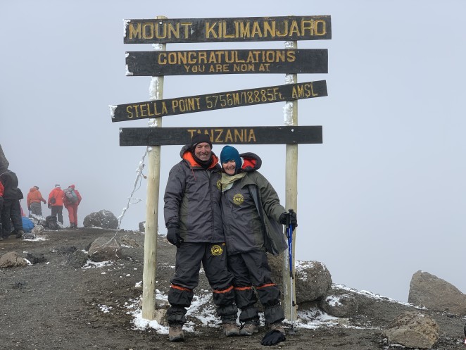 Carl and Sue on top of Mount Kilimanjaro during the 15th anniversary climb