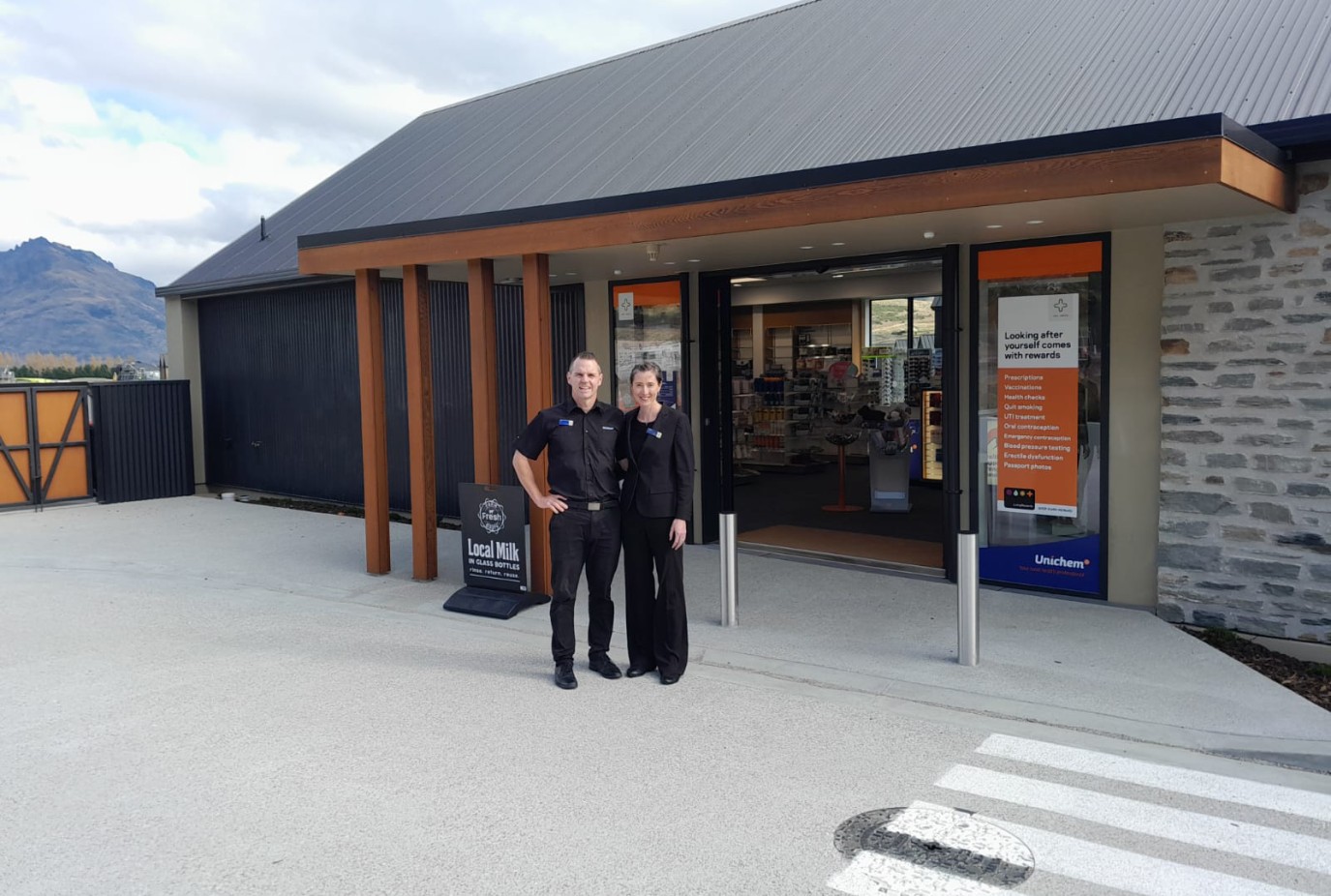 Clare right and husband JP outside their new Jacks Point Pharmacy copy