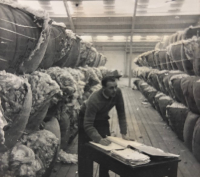 Derek valuing wool in the Wright Stephensons woolstore