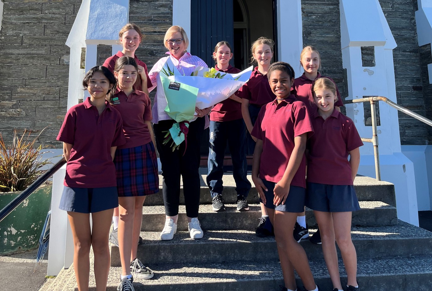 Di celebrating her last day teaching with some St Josephs pupils after her school farewell copy