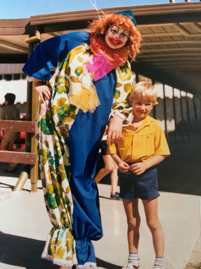 Di dressed up as a clown with pupil Mark Teviotdale at the Queenstown Primary School Fair around the late 80s early 90s