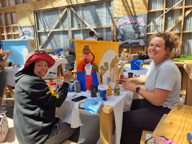 Esdira and Wilene Painting Afrida and Middle East library