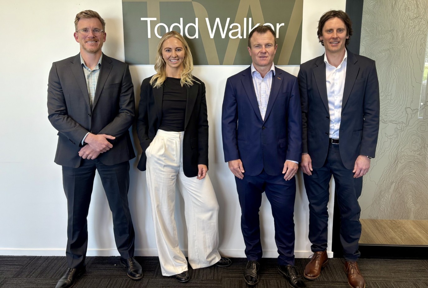 Group shot with sign