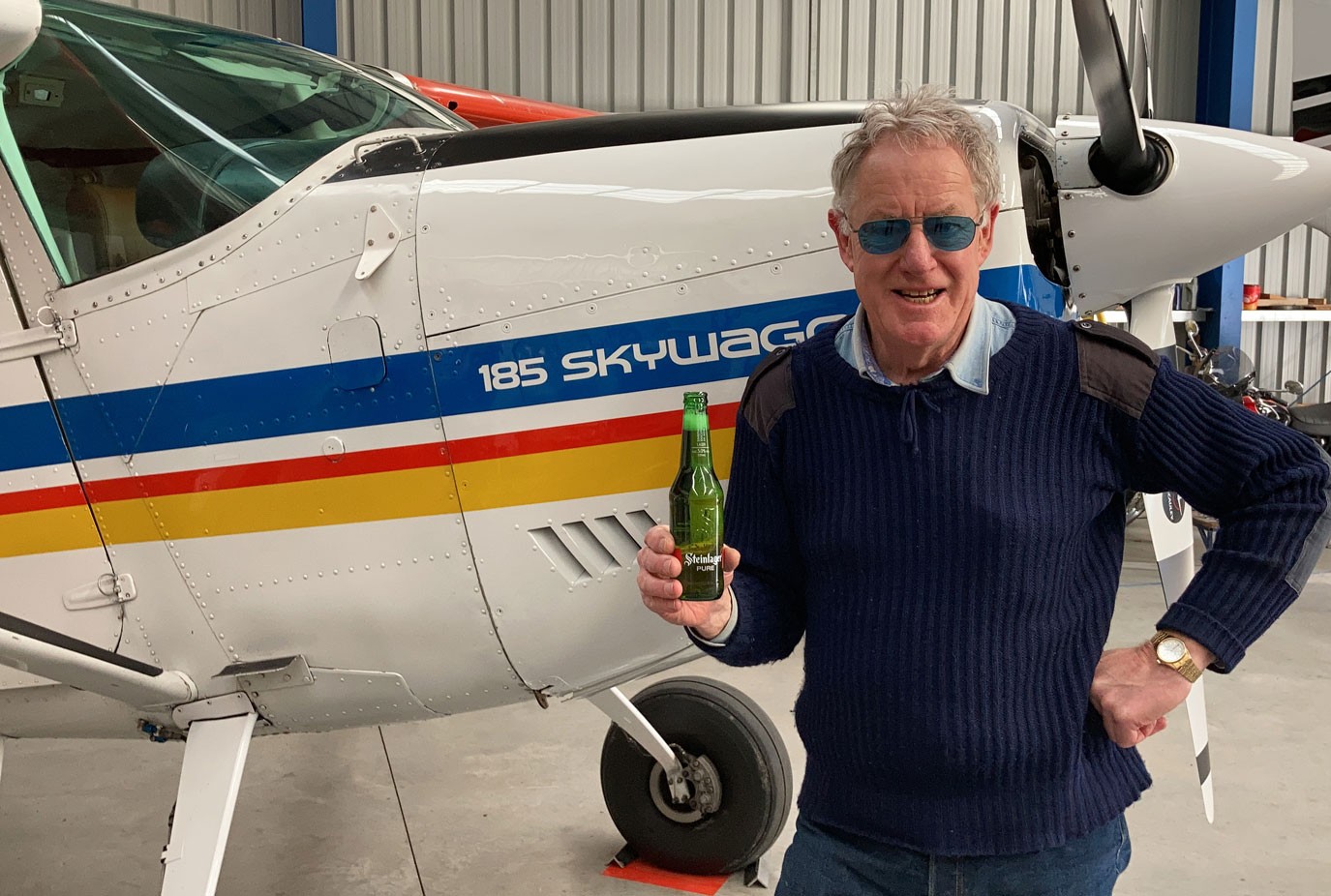 Hank toasting the MCV Cessna 185 Skywagon that he flew for Mount Cook in 1986 now owned by a friend and leased by air Milford