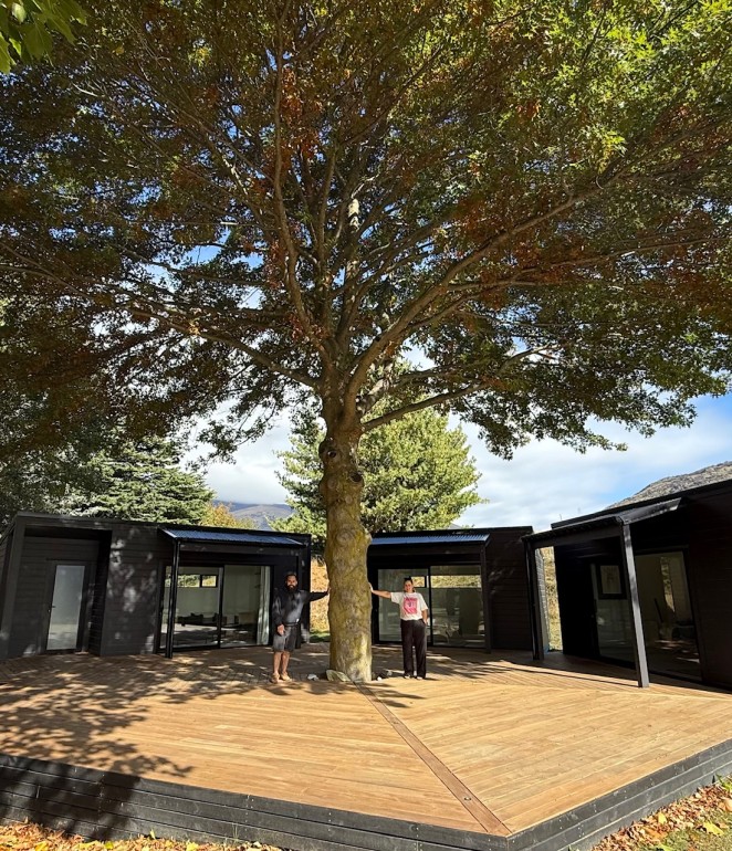 Heath and Kamile either side of the pin oak tree which is a focus of the AIO Healing Centre