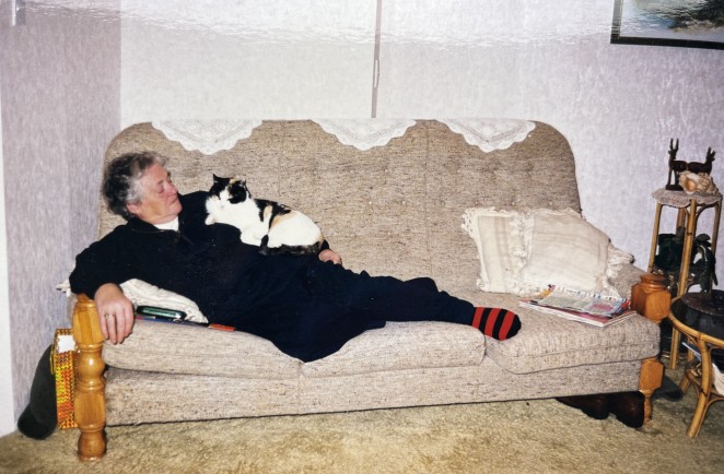 Helen taking a rare break with her cat Tina a regular passenger on the school bus 1982