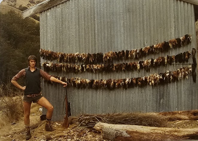 Ian showing off his goat tally while working for the NZ Forest Service in the 1970s