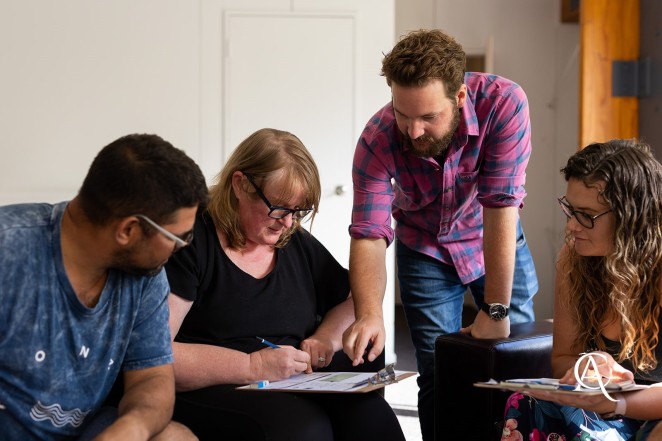 Joel Hillary centre explains the strategies in CashFlow to participants in a Cash Flow Hub course in Queenstown.2