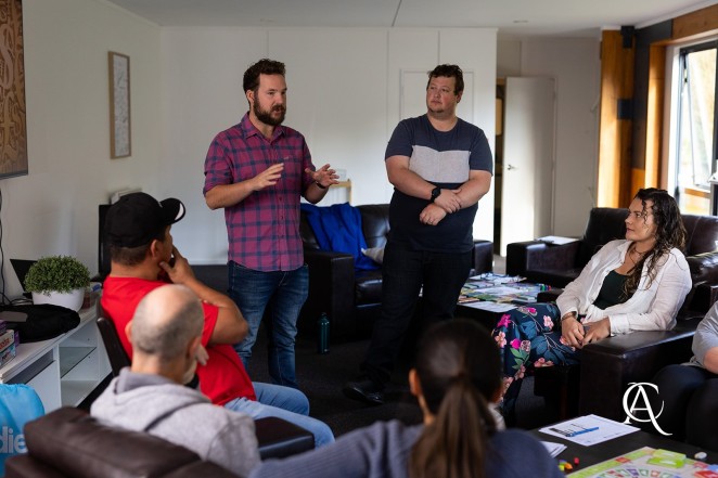 Joel left and Marcus standing explain the strategies of CashFlow at a Cash Flow Hub course in Queenstown