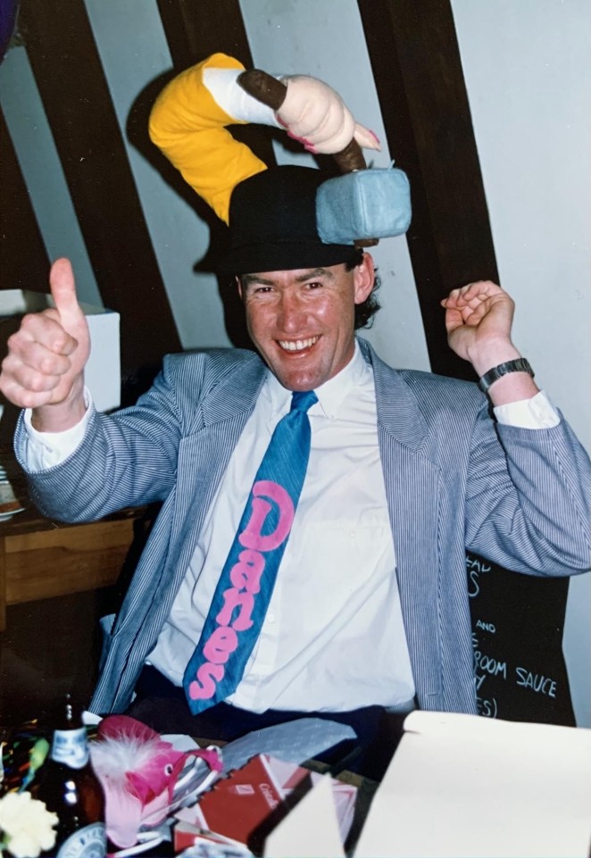 John celebrating his 35th birthday in the early 1990s with Danes staff who dressed him up in a Danes tie.