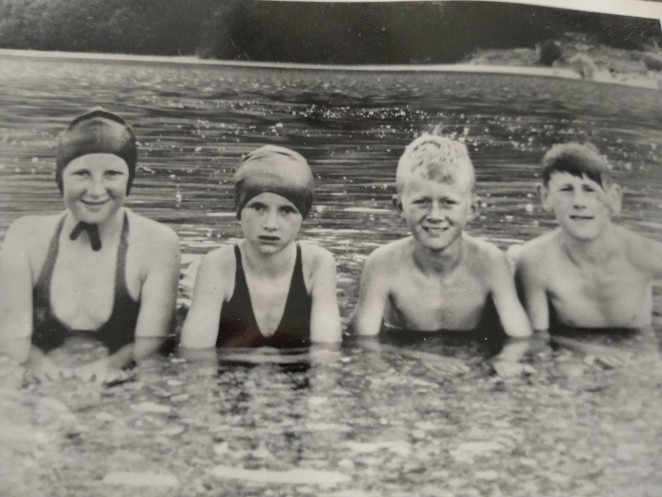 John second from right Richie Bryant far right Johns sister Doreen second from left and Ruth Bryant far left taking a dip back in the day.
