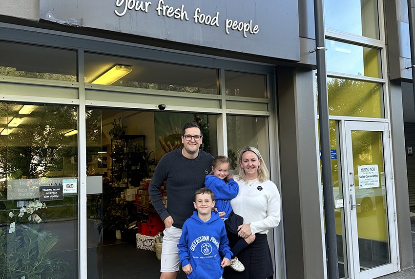 Jono and Jess with their children Reggie 7 and Sophie 5 outside their new business Raeward Fresh Queenstown small