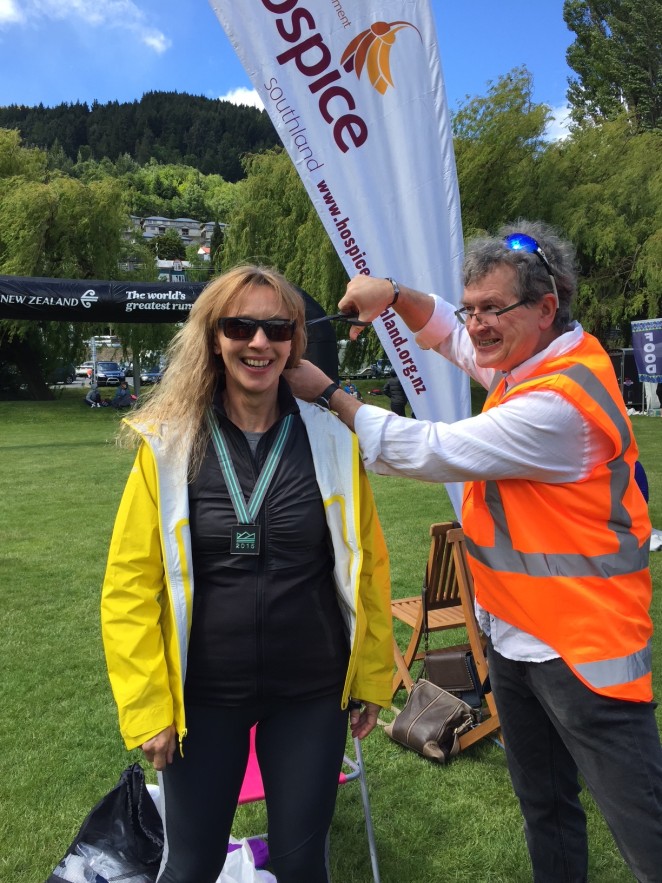 Kris right goes in for the chop after Kasias Hospice fundraising half marathon