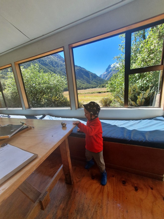 Little Alfie inside Routeburn Flats hut Routeburn Flats Hut Photo credits Bex Orpin