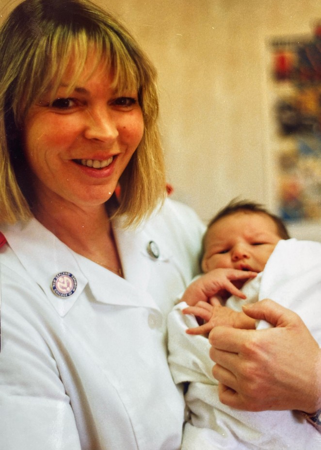 Mary with one of the six newborns born within a month in 1991