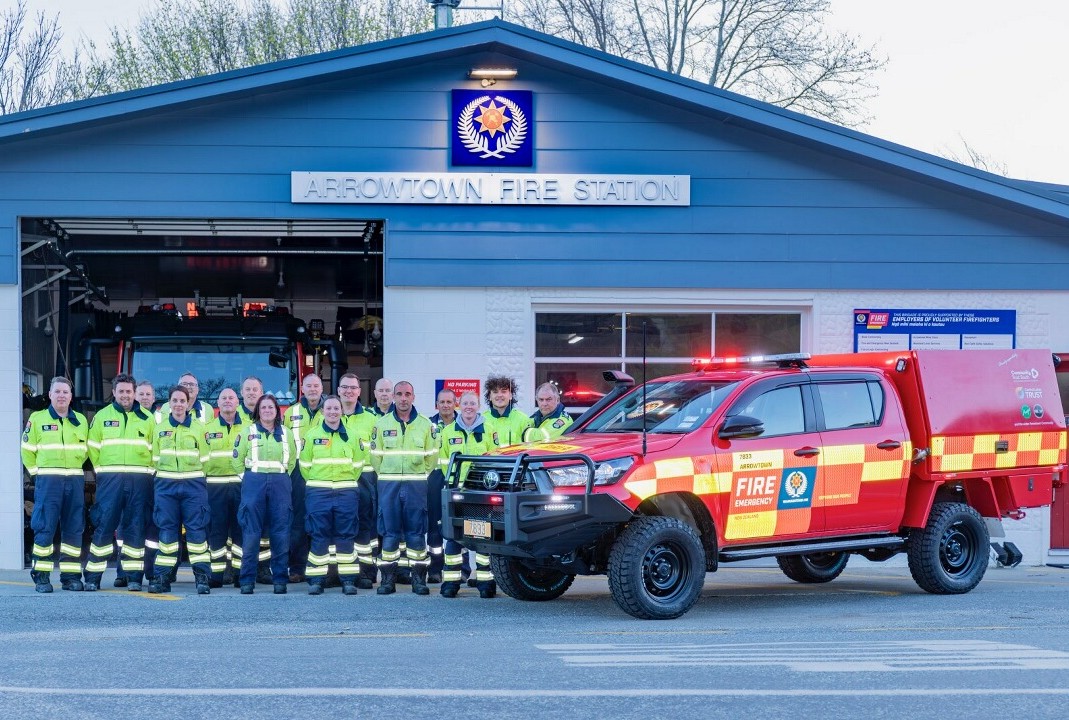 Members of the Arrowtown Volunteer Fire Brigade outside their station 1