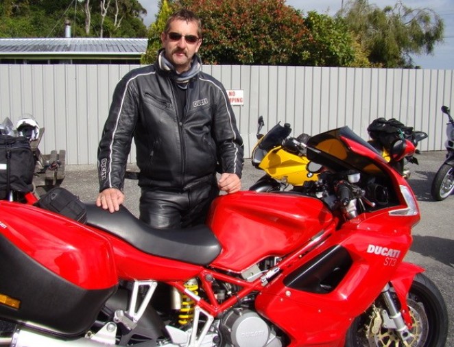 Mike enjoying his lifelong passion motorcycle touring back in the day