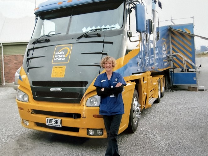 Nurse Lindsay in front of the surgical bus on a visit to Queenstown part of her role for nearly 20 years. Photo 2011.