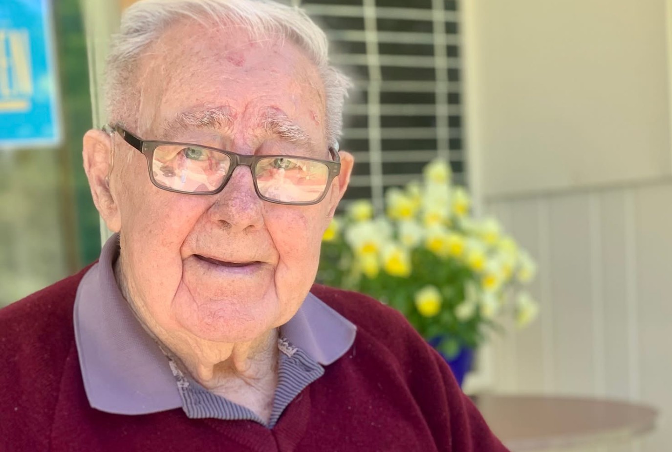 Owen Todd with the 100 year Queenstown Bowling Club history that he wrote for the 2004 celebration copy v2