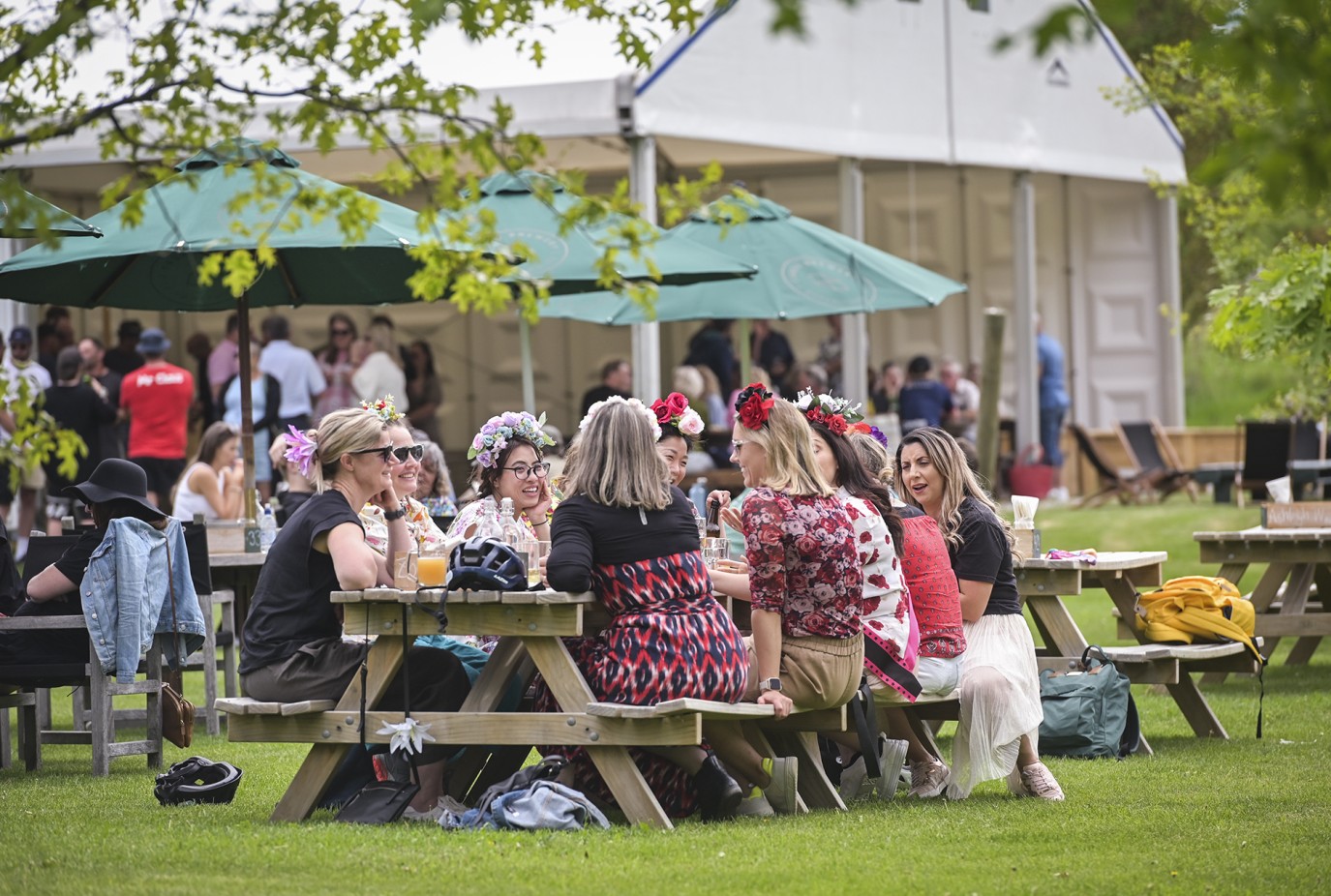 People enjoying the atmosphere at Cargo Cellar Door in Gibbston where Roam the Valley Wine Food Festival will be held