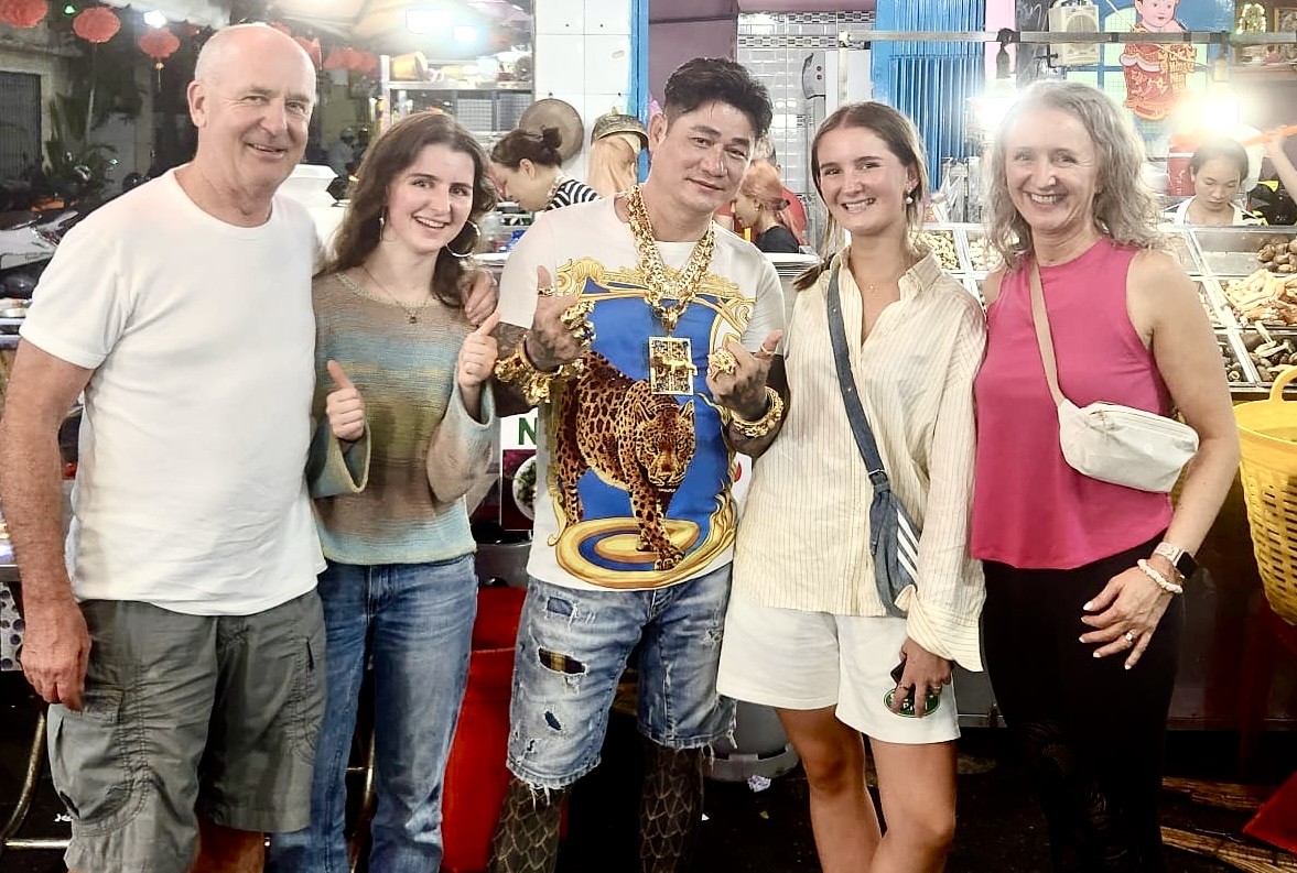 Rachel right with her family from left Mark Ruby and Scarlett at a snail party in Vietnam on holiday last year