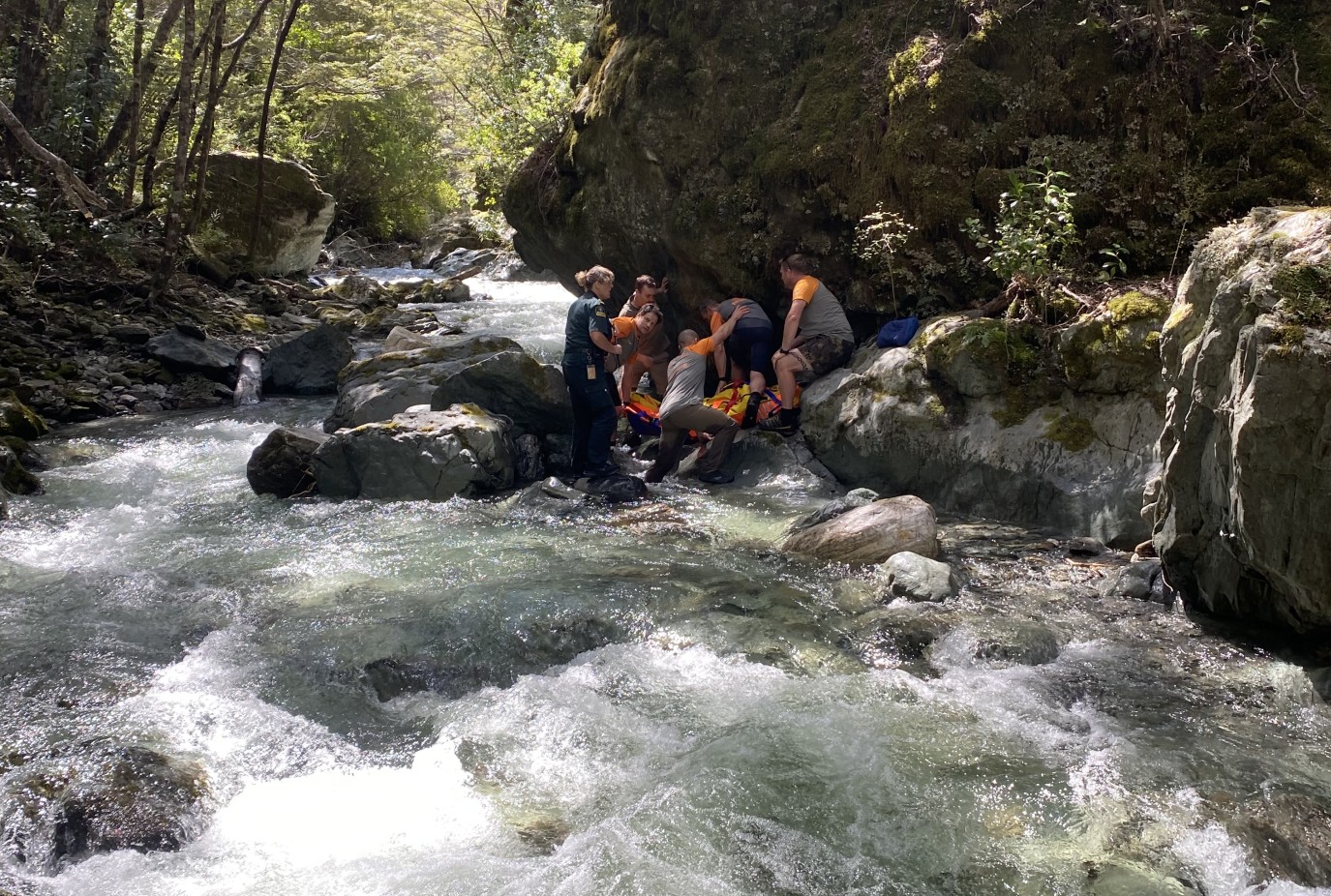 Rescuers working to retrieve a local man whod been goldminig off the Mount Crichton Loop 1
