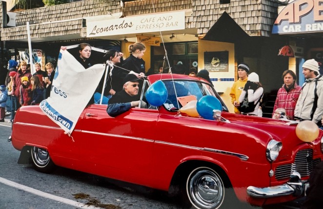 Richard driving flying the Gourmet Express flag during a Queenstown Winter Festival parade back in the day
