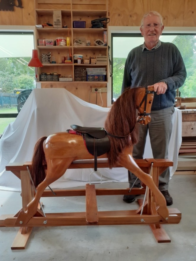 Russell Heckler with the beautifully restored rocking horse that Arrowtown MenzShed is selling v3