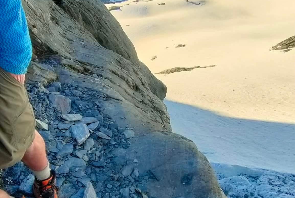 Standout Story Image Wakatipu alpine rescuers work to retreive this man obscured from a tiny 1m by 1m ledge above Rob Roy Glacier on Monday evening. Photo Wakatipu Alpine Cliff Rescue 