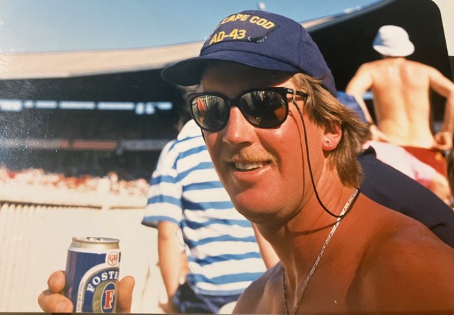 Steve enjoying a Fosters in his younger days.