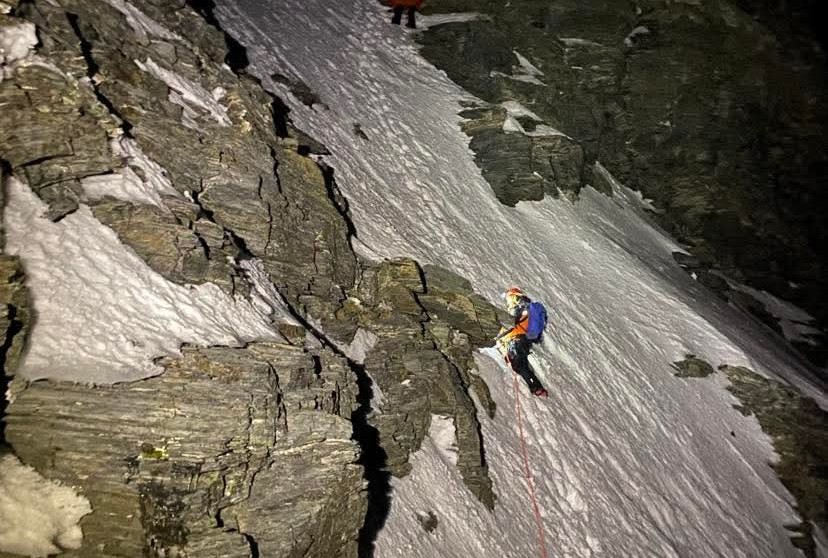 Wakatipu Alpine Cliff Rescue Team members Jono Gillan top and Karl Johnson bottom make their way up a steep snowy slope on Mount Earnslaw to rescue two Aussie climbers late on Sunday v3.