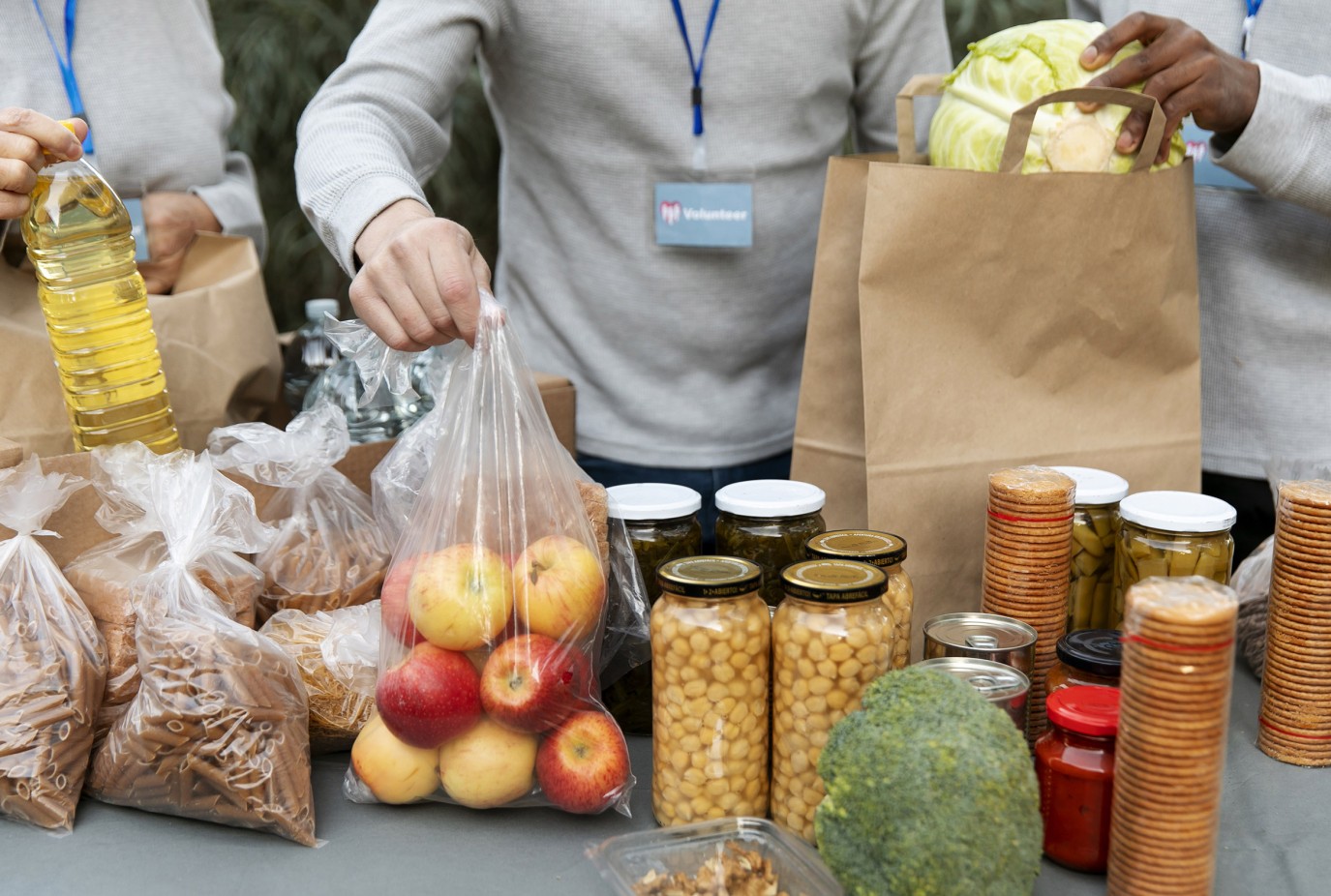 close up volunteers collecting food copy